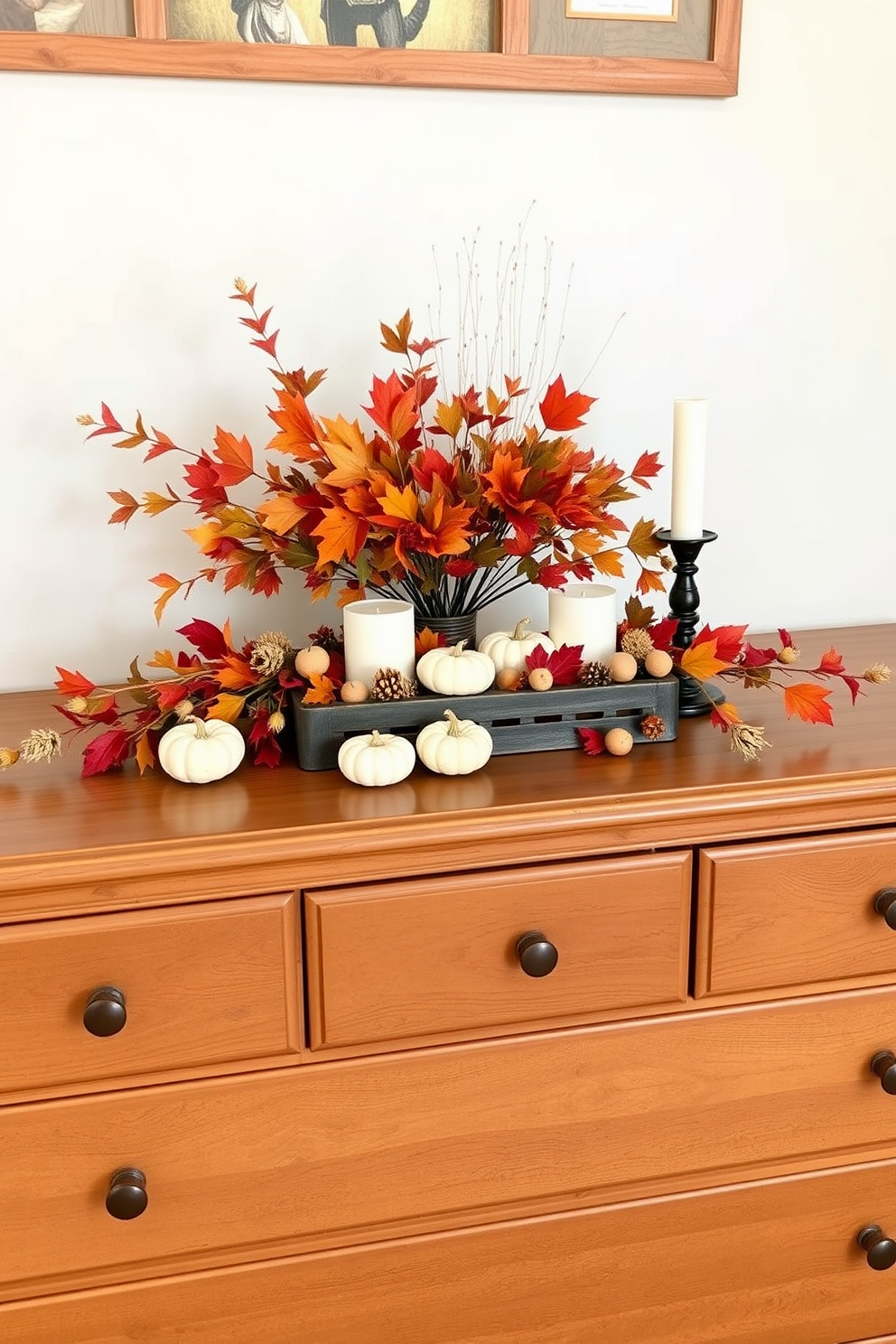 A cozy fall bedroom setting featuring a wooden dresser adorned with a seasonal centerpiece. The centerpiece includes a mix of vibrant autumn leaves, small pumpkins, and candles, creating a warm and inviting atmosphere.