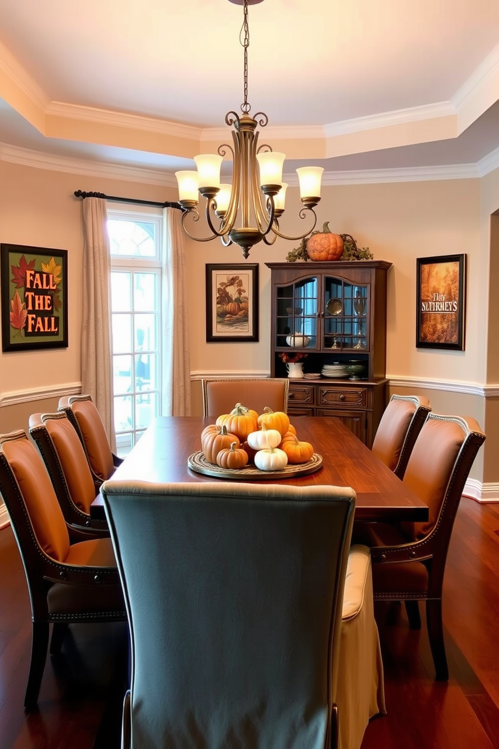 A warm and inviting dining room adorned with seasonal artwork reflecting the colors of fall. The walls are decorated with framed pieces showcasing autumn leaves and harvest themes, creating a cozy atmosphere. A rustic wooden dining table is set for a festive meal, surrounded by comfortable upholstered chairs in rich, earthy tones. Soft lighting from a chandelier above enhances the inviting ambiance, while a centerpiece of pumpkins and gourds adds a seasonal touch.