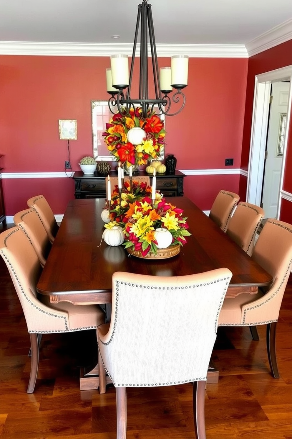 A vibrant dining room decorated for fall features a large wooden table at the center adorned with colorful seasonal wreaths as stunning centerpieces. Surrounding the table are elegant upholstered chairs in warm tones, and the walls are painted in a rich, earthy hue to complement the autumn theme.