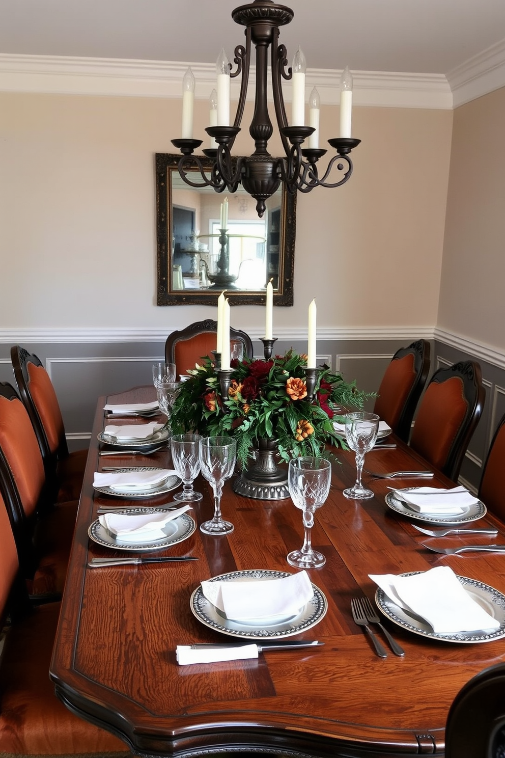 A vintage wooden dining table is set with an elegant arrangement of silverware, featuring intricate designs that reflect a timeless charm. Surrounding the table are upholstered chairs in rich, warm tones, complemented by a centerpiece of seasonal foliage and candles. The walls are adorned with soft, neutral colors, creating a cozy ambiance that invites gathering. A vintage chandelier hangs above, casting a warm glow over the table and enhancing the overall inviting atmosphere.