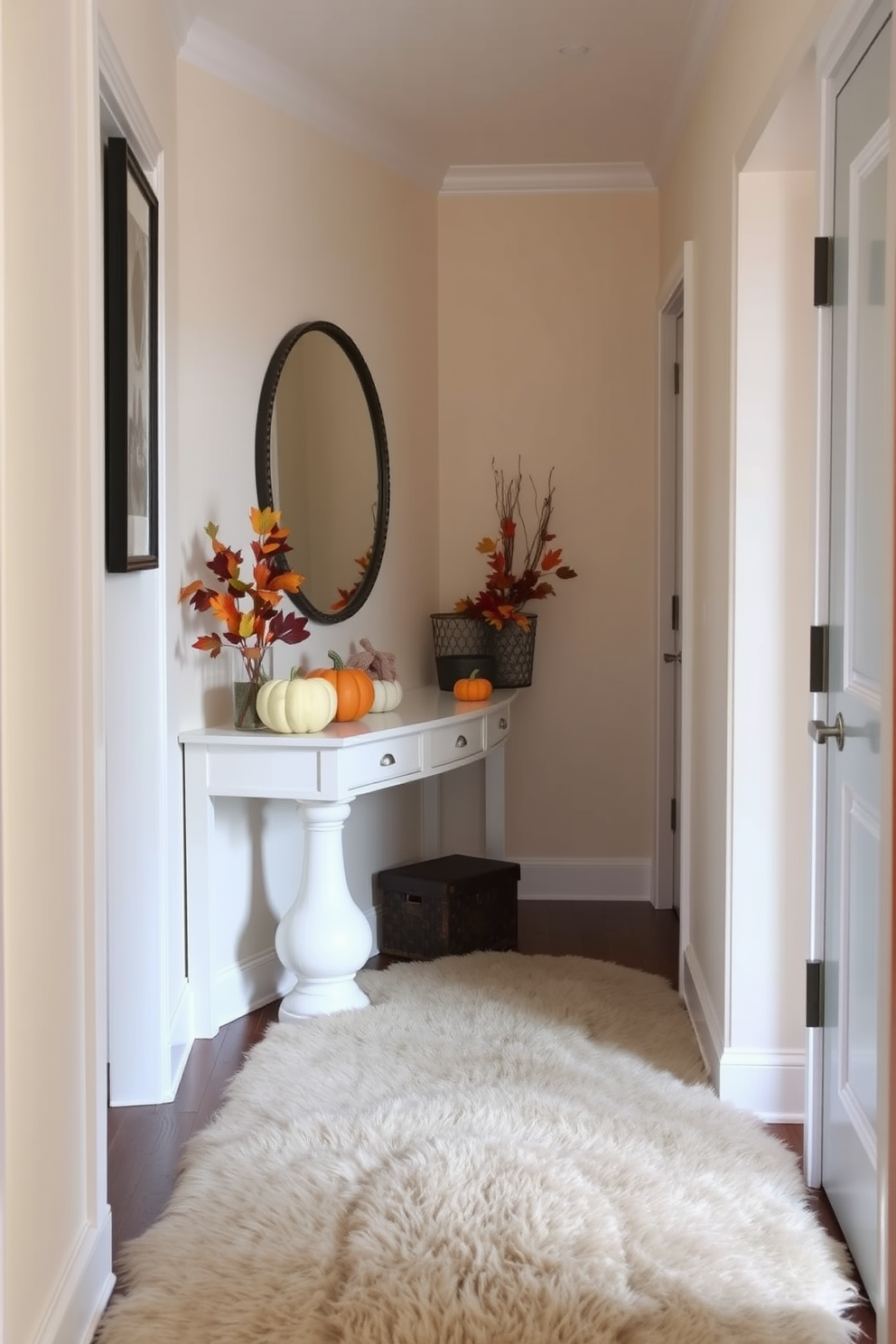 A cozy hallway adorned with a luxurious faux fur rug that adds warmth and texture to the space. The walls are painted in a soft cream color, and seasonal fall decorations such as pumpkins and autumn leaves are tastefully arranged along the console table.