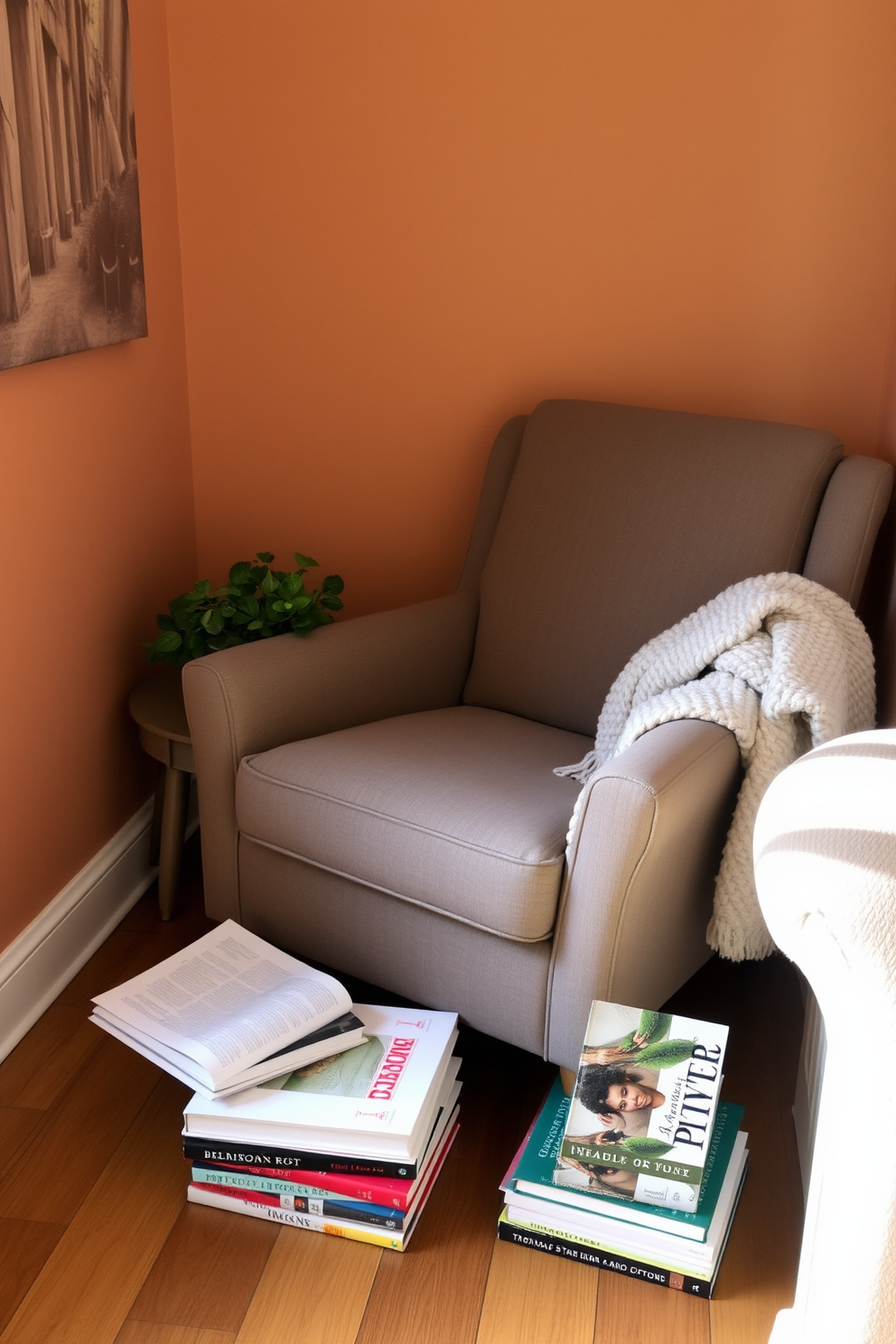 A cozy reading nook is created in a corner with a comfortable armchair upholstered in soft fabric. A small indoor plant sits on a nearby side table, adding a touch of freshness to the space. The walls are adorned with warm, earthy tones, and a plush throw blanket drapes over the armchair. A stack of books is neatly arranged on the floor beside the chair, inviting you to unwind and enjoy a good read.