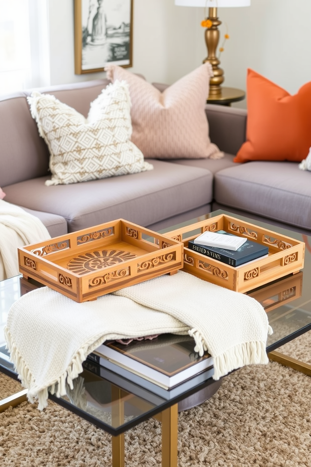 Chic decorative trays for organization. The trays are made of natural wood and feature intricate carvings, placed on a stylish coffee table adorned with a cozy throw and a few curated books. Fall small living room decorating ideas. The space is accented with warm tones of orange and gold, with plush cushions and a soft rug that invite comfort and a seasonal ambiance.