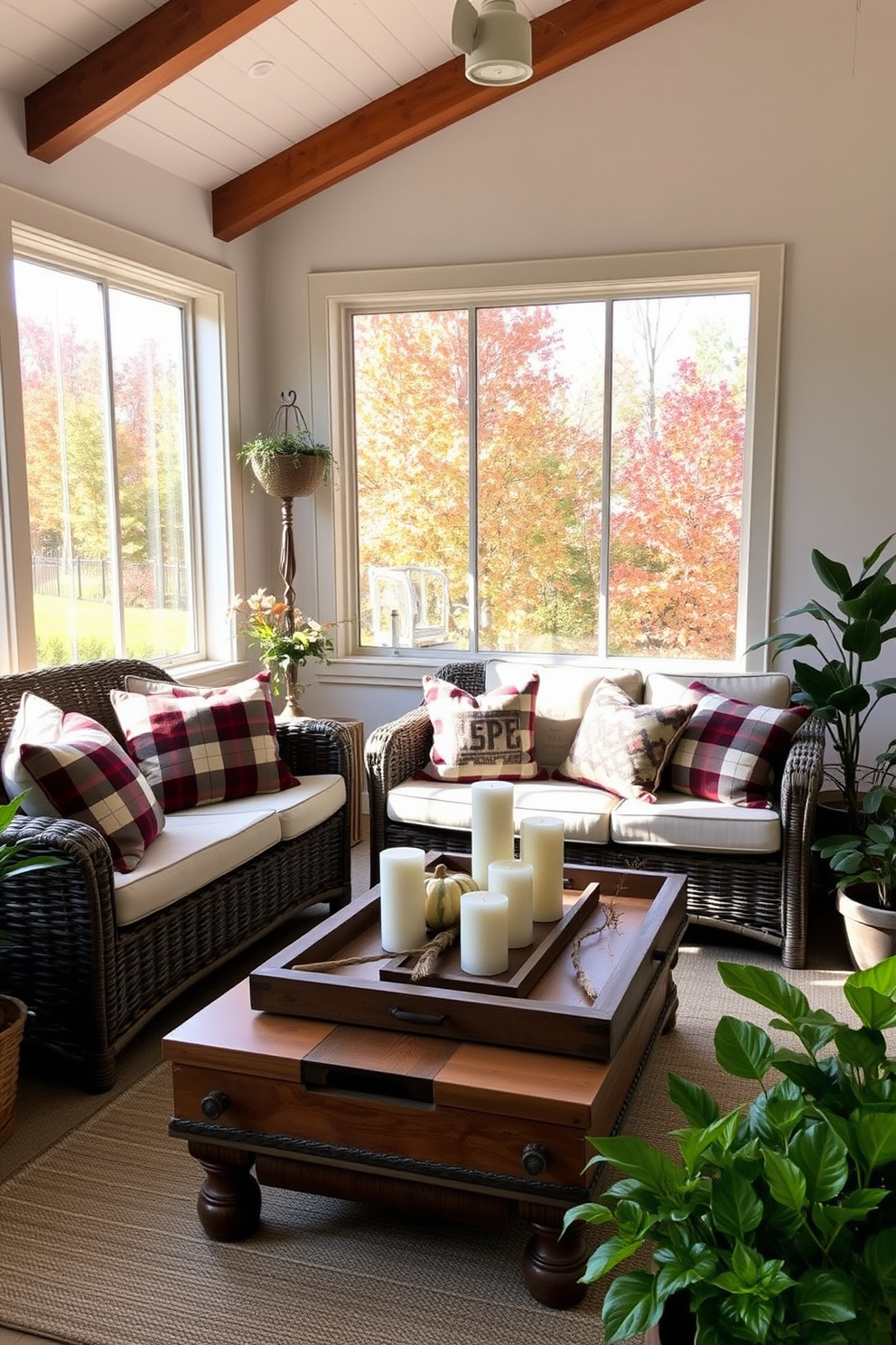 A cozy sunroom filled with natural light features plaid-patterned throw pillows on a comfortable wicker sofa. The walls are adorned with wooden beams, and a large window offers a view of the colorful autumn foliage outside. A rustic coffee table made of reclaimed wood sits at the center, topped with a decorative tray holding candles and seasonal decor. Potted plants in various sizes are placed around the room, enhancing the warm and inviting atmosphere.