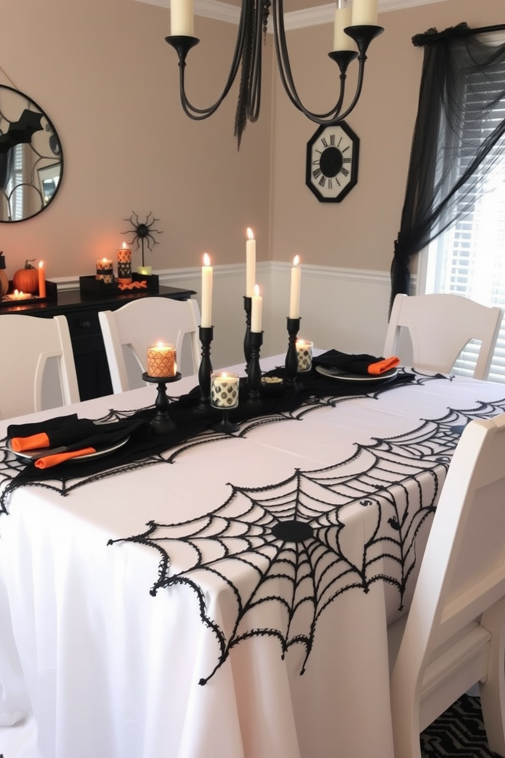 A dining table is elegantly draped with a spider web tablecloth, creating a spooky yet stylish atmosphere for Halloween. Surrounding the table, there are black and orange accents, with flickering candle holders and seasonal decorations that enhance the festive vibe.