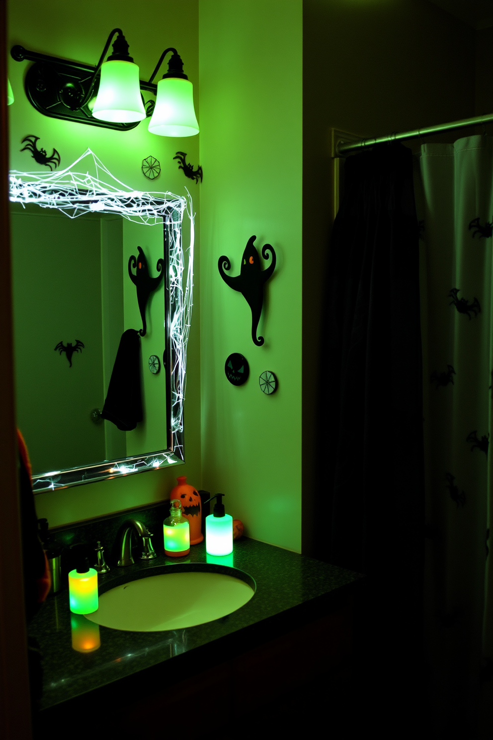 A spooky bathroom setting featuring glow in the dark accessories that create an eerie ambiance. The walls are adorned with Halloween-themed decals and the countertop displays a collection of luminescent soap dispensers and toothbrush holders. The mirrors are framed with cobwebs and small LED lights that flicker like candles. A black and orange color scheme dominates the space, while a spooky shower curtain completes the Halloween decor.