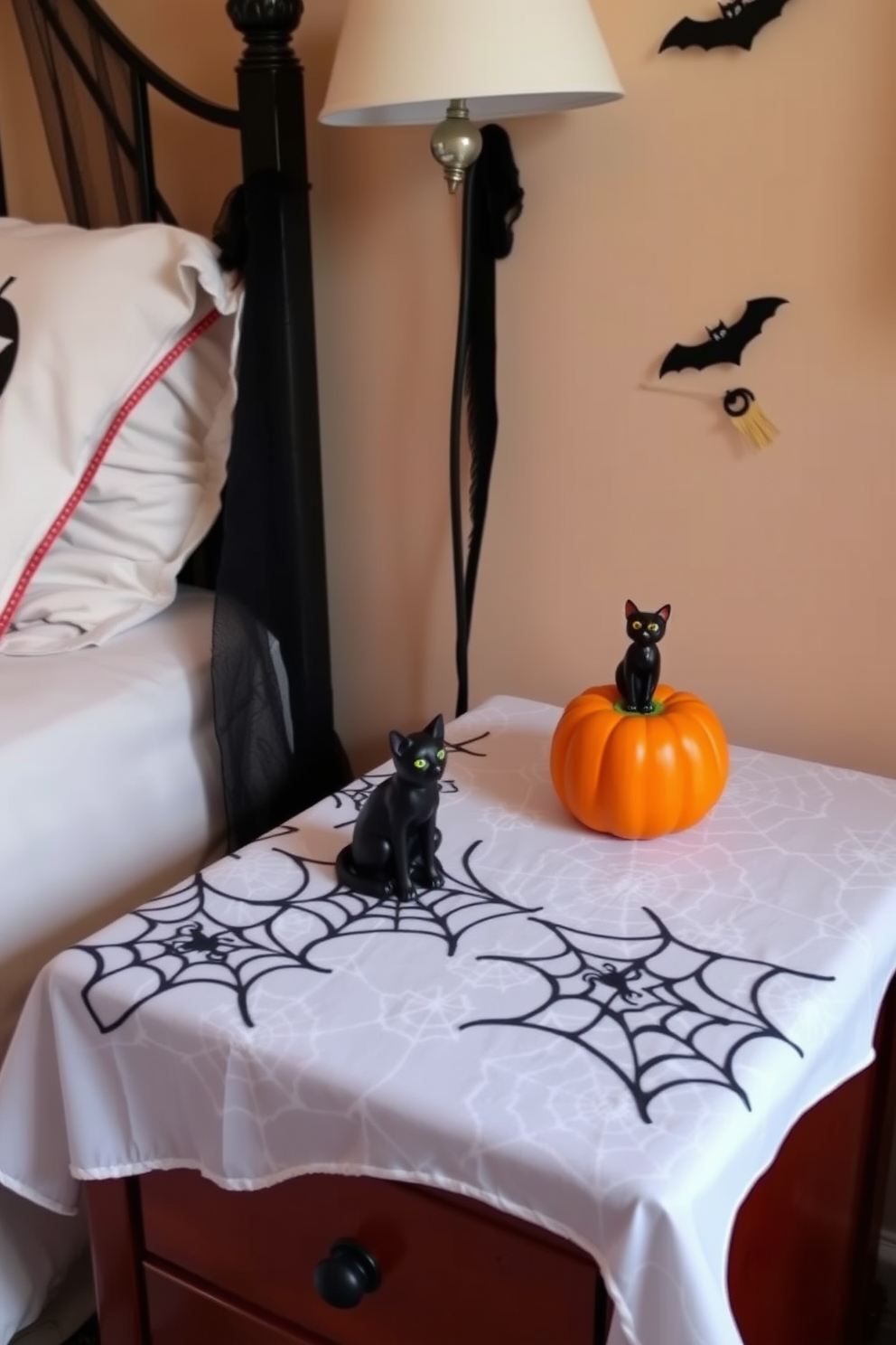 A Halloween-themed bedroom featuring a nightstand adorned with a spider web tablecloth. The nightstand is complemented by a small pumpkin candle and a spooky black cat figurine, creating an inviting yet eerie atmosphere.