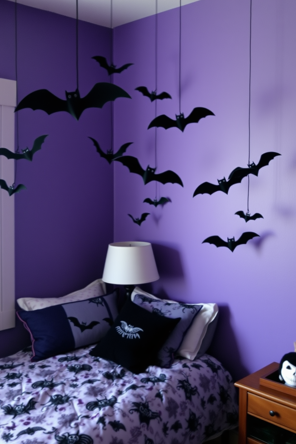 Create a whimsical Halloween bedroom with hanging bats from the ceiling corners. The walls are painted in deep purple, and the bedding features spooky patterns to enhance the festive atmosphere.