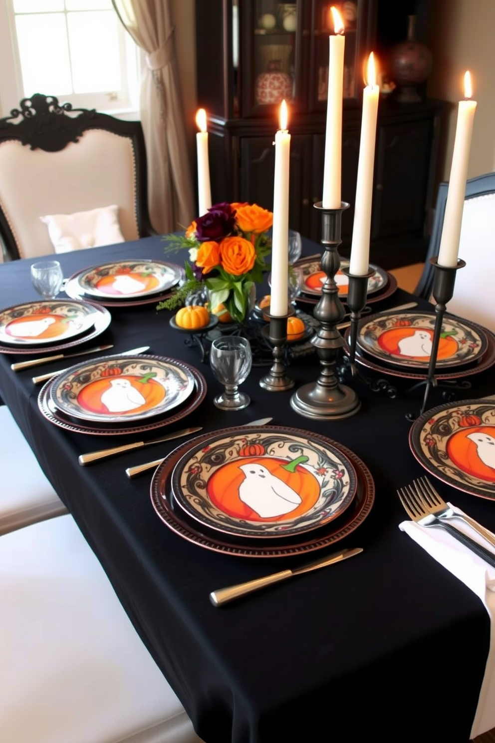 A beautifully arranged dining table features Halloween-themed dinnerware with intricate designs of pumpkins and ghosts. The table is adorned with a black tablecloth, and flickering candle holders create a warm and inviting atmosphere for the festive occasion.