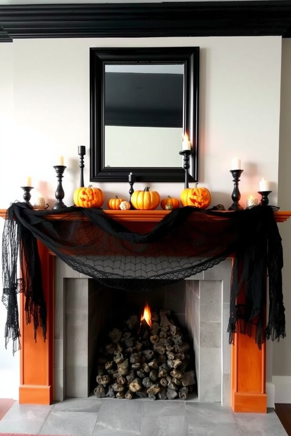 A striking fireplace adorned for Halloween features a dramatic black and orange color scheme. The mantel is decorated with carved pumpkins, flickering candles in black holders, and elegant black lace draping down the sides.