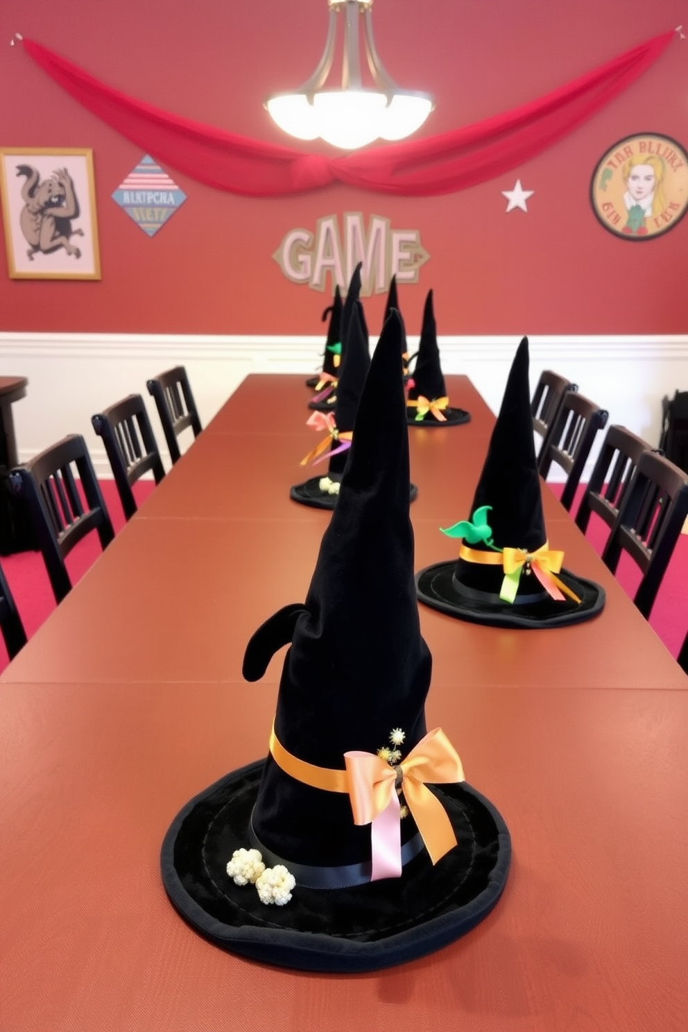 A whimsical game room setting featuring a long table adorned with unique witch hat centerpieces. Each hat is crafted from black velvet and embellished with colorful ribbons and small decorative elements, creating a playful yet sophisticated atmosphere.