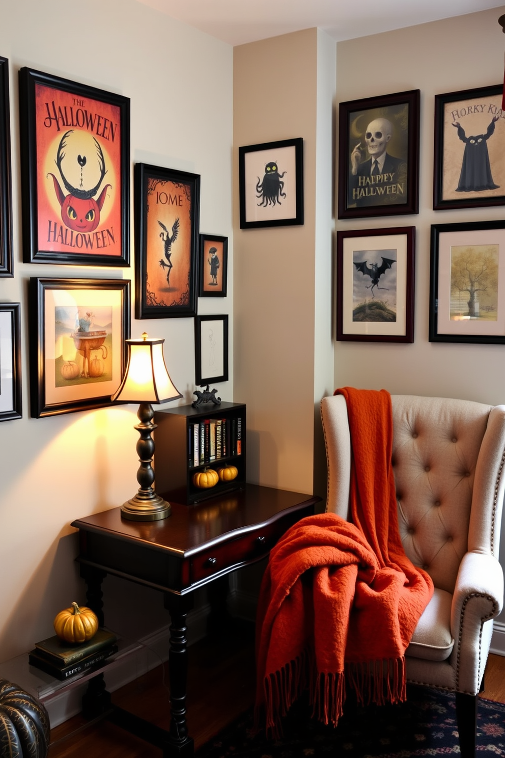 A cozy home office adorned with framed Halloween art on the walls. The desk is made of dark wood and features a vintage lamp with a warm glow. A plush armchair sits in the corner, draped with an orange and black throw blanket. A small bookshelf displays spooky novels and decorative pumpkins, adding to the festive atmosphere.