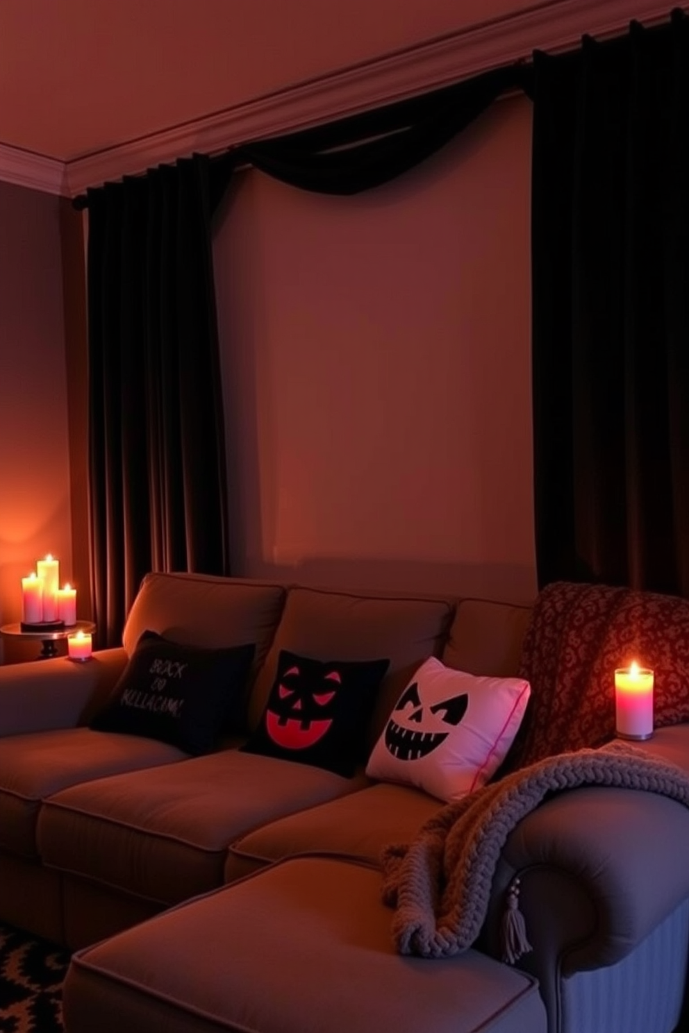 A cozy home theater setting for Halloween. Dim lighting creates an intimate atmosphere enhanced by flickering candles placed around the room. Rich, dark curtains frame the windows, blocking out any outside light. A plush, oversized sofa is adorned with Halloween-themed throw pillows and blankets.