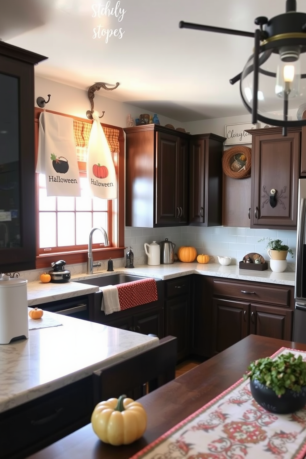 A cozy kitchen adorned with Halloween-themed dish towels hanging on rustic hooks. The countertops are decorated with small pumpkins, and a festive table runner adds a touch of seasonal charm.