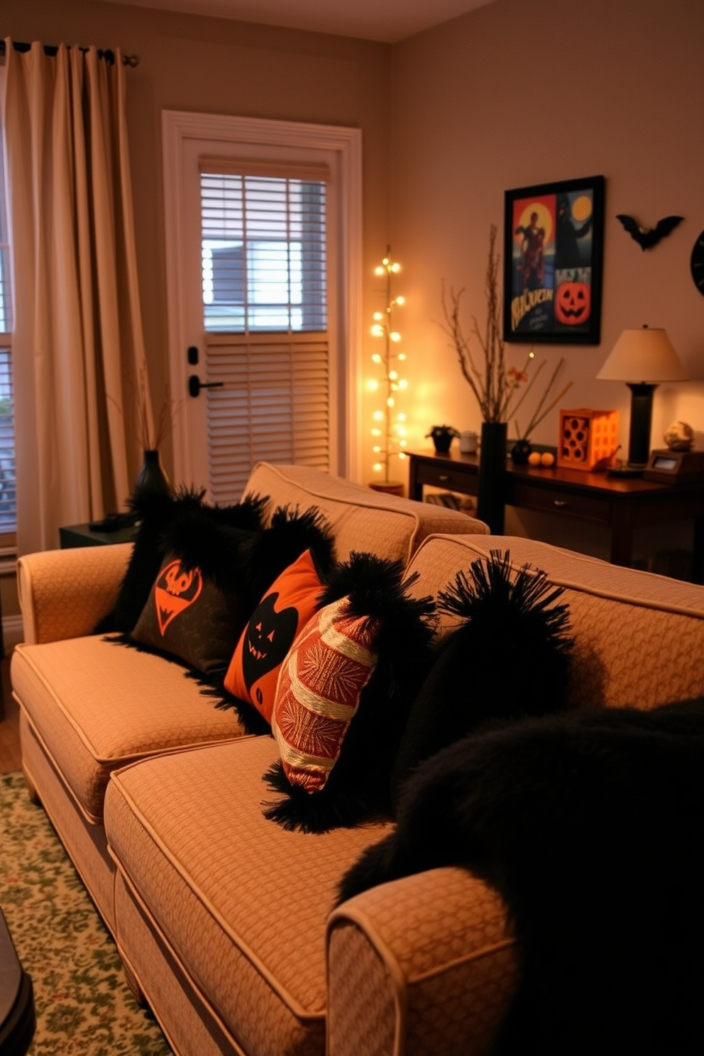 A cozy living room decorated for Halloween features a plush sofa adorned with black and orange throw pillows. The space is illuminated by soft lighting that creates a warm ambiance, with subtle Halloween-themed decorations enhancing the festive atmosphere.