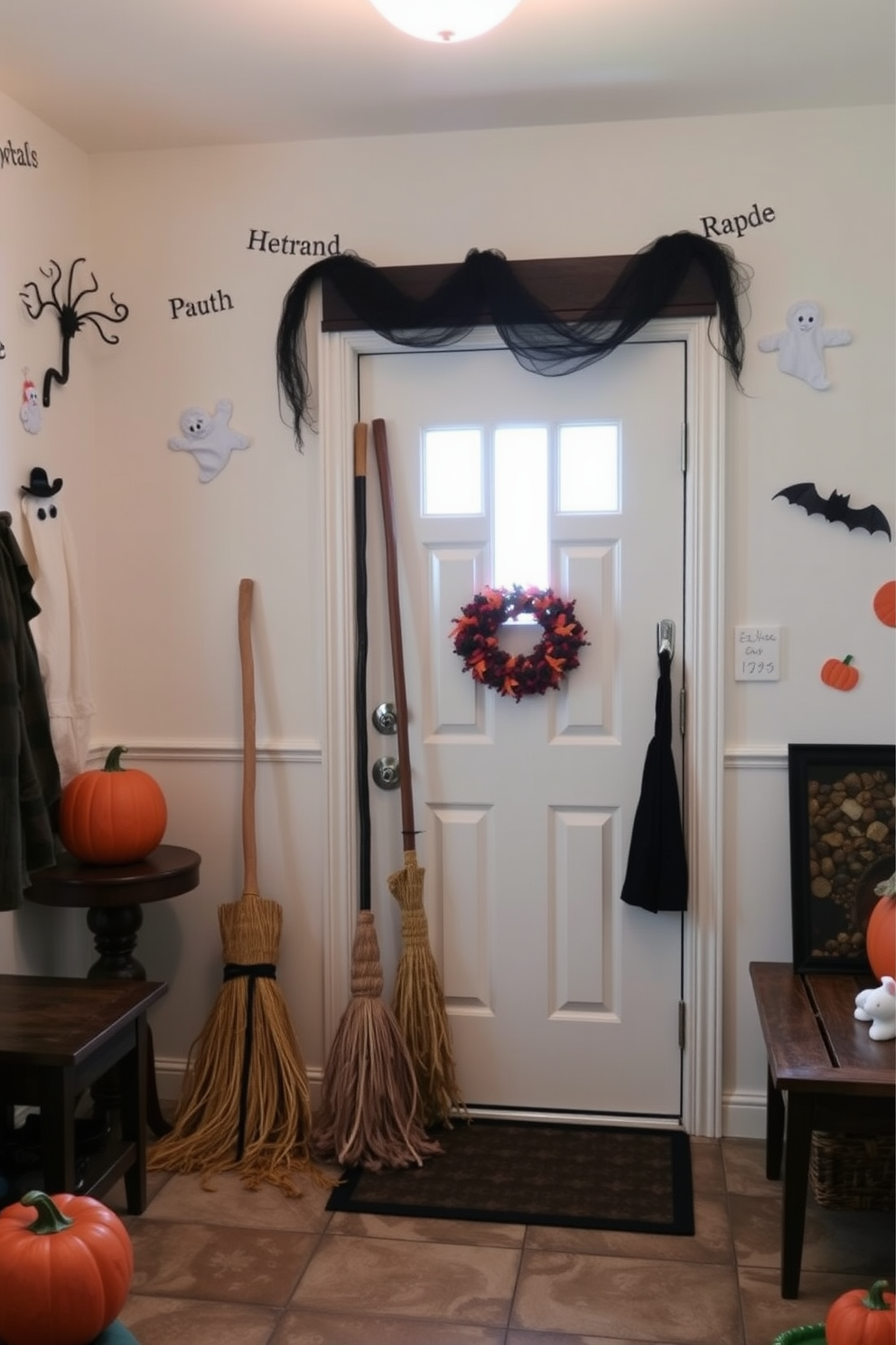 A cozy mudroom decorated for Halloween features broomsticks hanging artfully near the door. The walls are adorned with playful ghost and pumpkin decorations, creating a festive atmosphere.