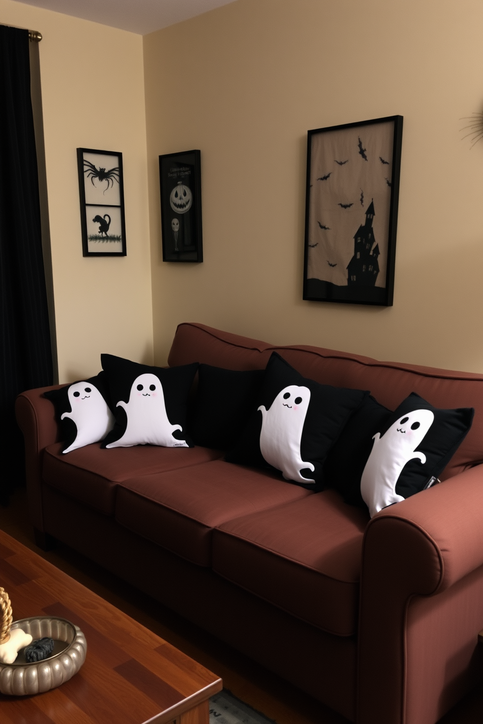 Spooky throw pillows with ghost designs are scattered across a cozy small living room sofa. The walls are adorned with subtle Halloween-themed art, creating an inviting yet eerie atmosphere perfect for the season.