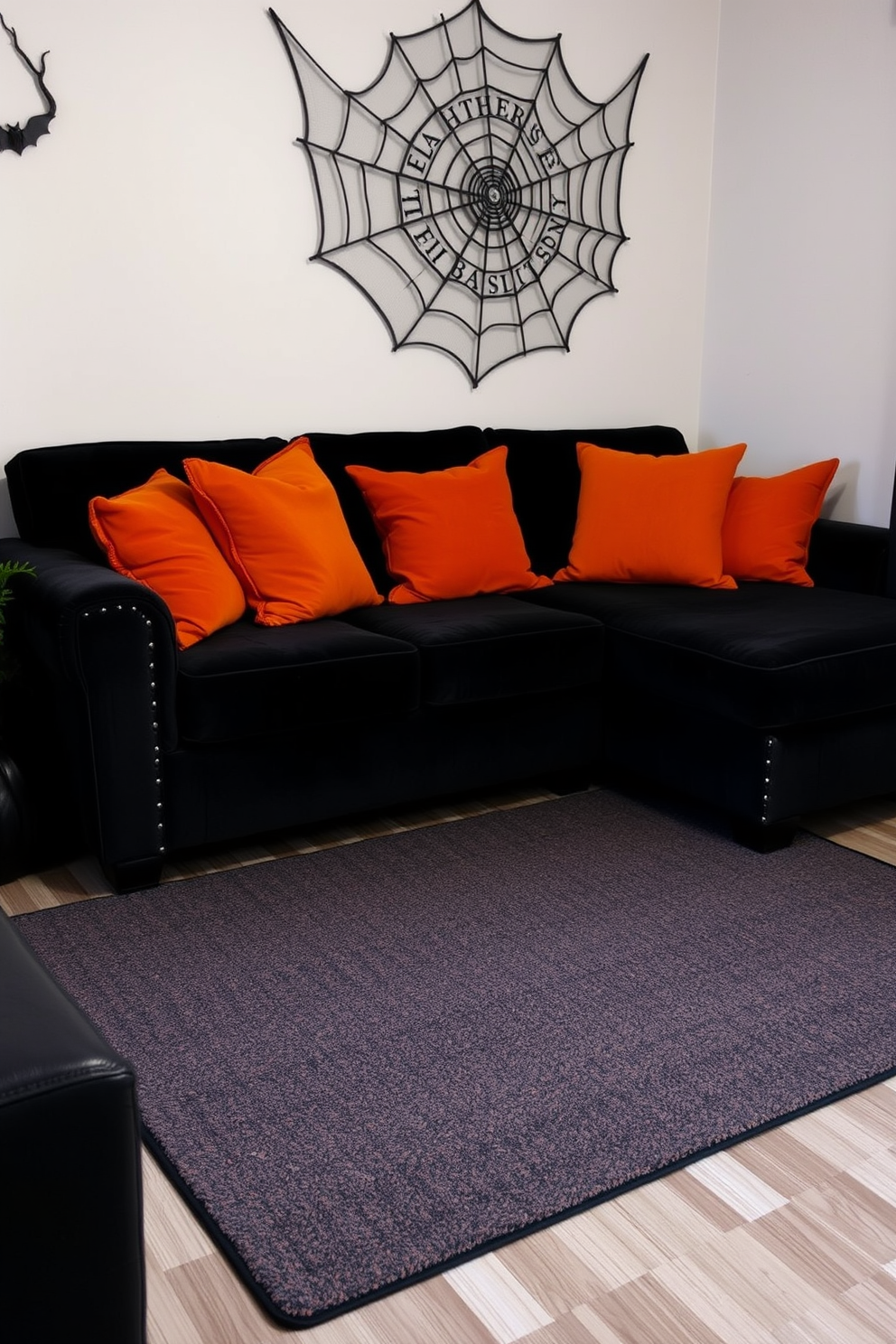 A cozy small living room features a black and orange striped area rug that adds a festive touch for Halloween. The rug is complemented by a plush black sofa adorned with orange throw pillows, creating a warm and inviting atmosphere.