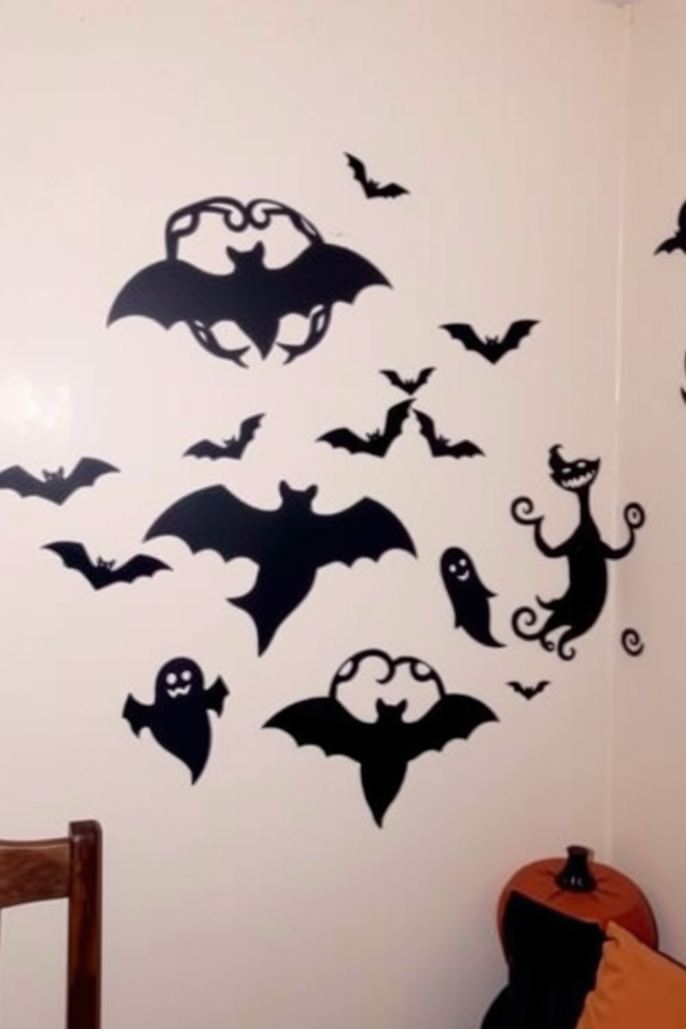 Spooky wall art featuring intricate paper cutouts hangs on the walls, creating an eerie yet artistic atmosphere. The decor includes silhouettes of bats and ghosts, adding a playful touch to the Halloween theme. In a small space, clever arrangements of these cutouts can transform the room without overwhelming it. Soft lighting enhances the spooky vibe, perfect for festive gatherings while maintaining a cozy feel.