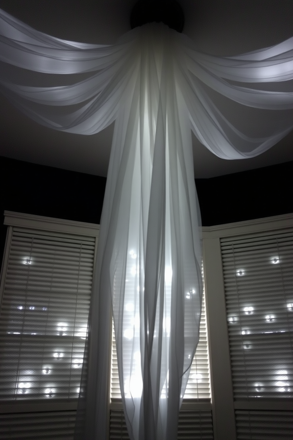 Create a ghostly silhouette using sheer white fabric draped from the ceiling to create an ethereal effect. Incorporate soft lighting behind the fabric to enhance the spooky ambiance while maintaining a cozy atmosphere in your small space.