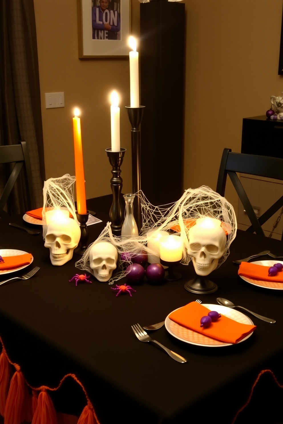 A spooky table setting for meals features a black tablecloth adorned with orange and purple accents. Flickering candlelight illuminates skull-shaped candle holders and a centerpiece of faux cobwebs with plastic spiders. For small space decorating ideas, consider using multi-functional furniture that maximizes storage while maintaining a stylish aesthetic. Incorporate mirrors to create an illusion of space and use light colors to brighten the area.