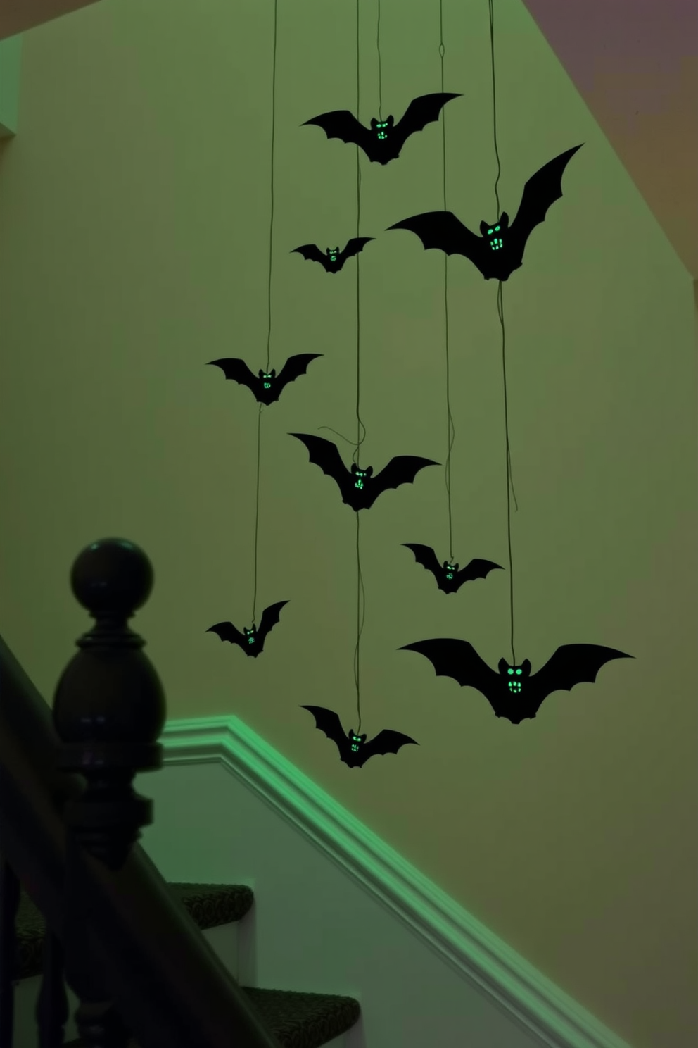 Create a whimsical Halloween staircase adorned with hanging bats painted in glow-in-the-dark colors. The bats should vary in size and be suspended at different heights to create a dynamic and enchanting display.