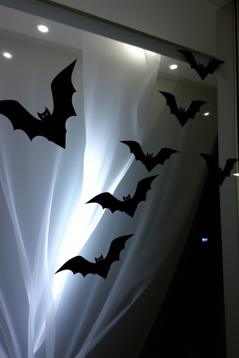 A whimsical Halloween window display featuring paper bats soaring gracefully across a large glass window. The backdrop includes a soft, eerie glow from strategically placed LED lights, enhancing the spooky atmosphere.