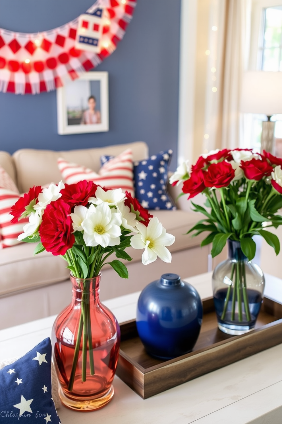 Create a vibrant living room setting featuring flower arrangements in red white and blue hues to celebrate Independence Day. The arrangements should be displayed in stylish vases on a coffee table surrounded by festive decor elements like stars and stripes cushions. Incorporate a cozy seating area with a neutral sofa adorned with patriotic throw pillows. Use decorative elements such as banners and string lights to enhance the festive atmosphere while maintaining a chic and inviting ambiance.