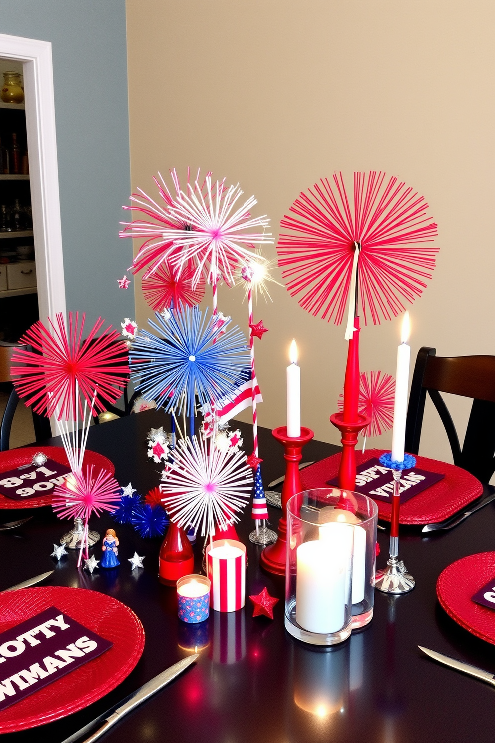 A vibrant tabletop display for Independence Day featuring an array of colorful fireworks decorations. The table is adorned with red white and blue accents including small fireworks figurines and festive candles to create a celebratory atmosphere.