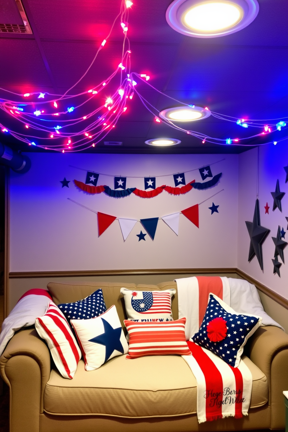 A cozy basement space decorated for Independence Day features red white and blue string lights draped across the ceiling. The walls are adorned with festive banners and stars while a comfortable seating area is set up with patriotic throw pillows and blankets.