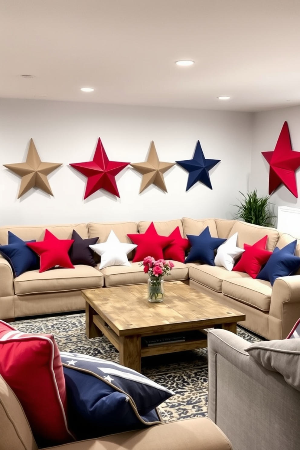 A cozy basement living area adorned with star shaped decorative pillows in red white and blue hues. The pillows are scattered across a plush sectional sofa, creating a festive atmosphere for Independence Day celebrations. The walls are painted a soft gray to enhance the brightness of the space. A rustic coffee table sits at the center, surrounded by comfortable seating, making it the perfect spot for gatherings.