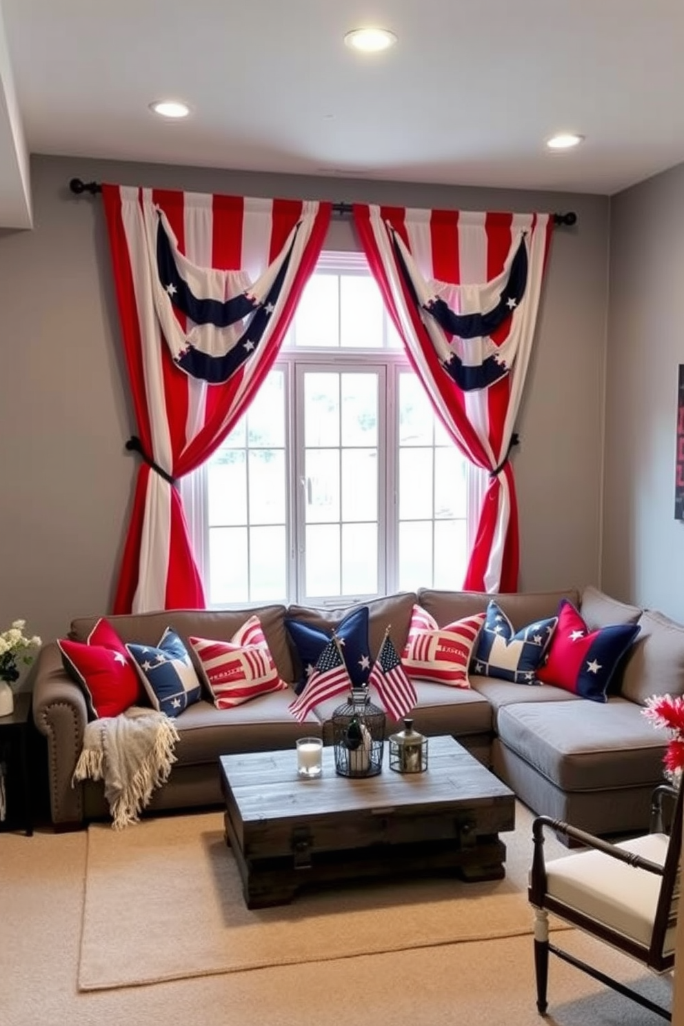 A cozy basement space decorated for Independence Day features red white and blue curtains that frame a large window. The walls are painted a soft gray to complement the vibrant colors of the curtains while providing a warm and inviting atmosphere. A comfortable seating area includes a plush sectional sofa adorned with patriotic throw pillows. A rustic coffee table sits in the center, surrounded by decorative elements such as small American flags and festive centerpieces.