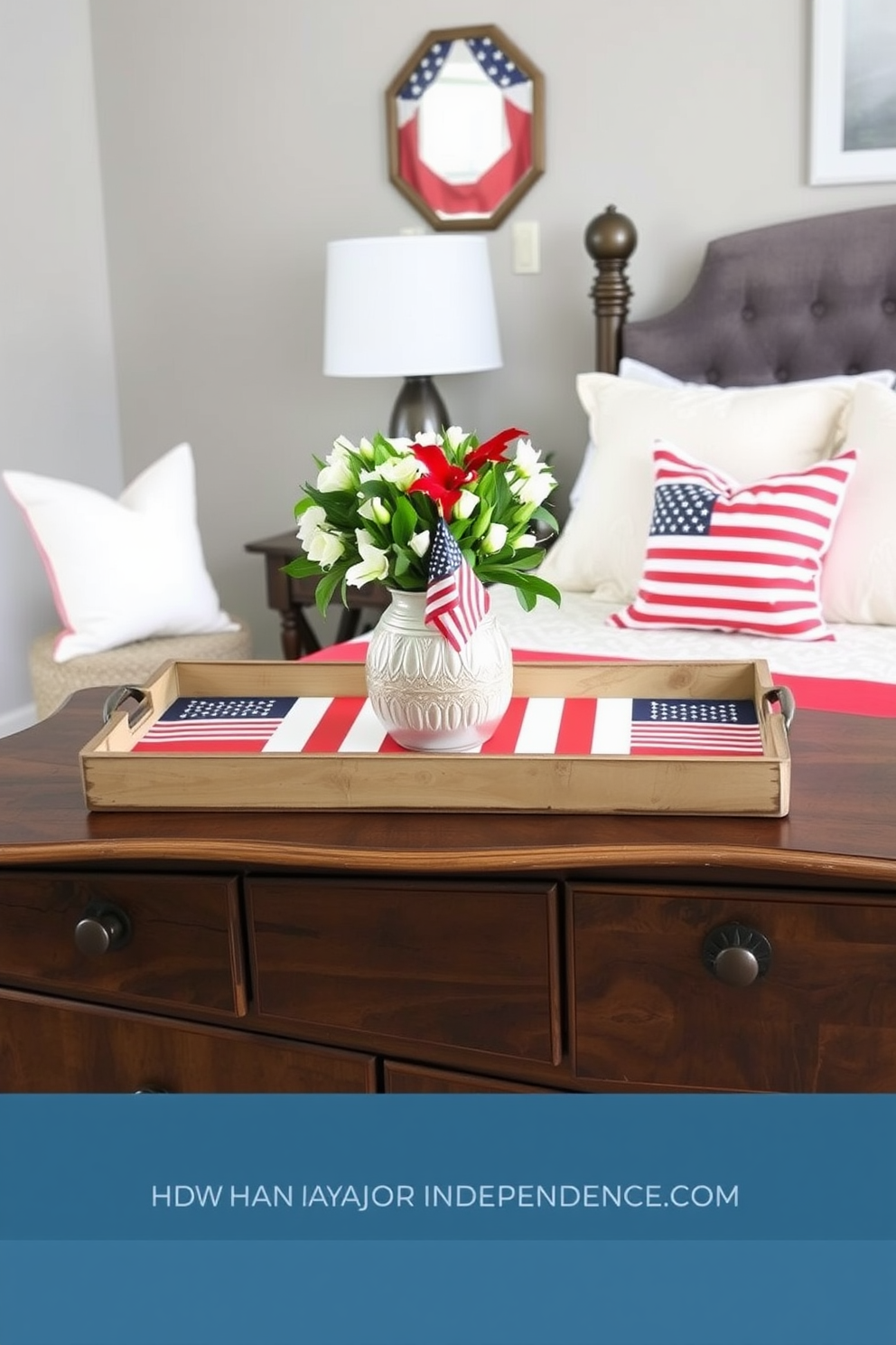 A cozy bedroom decorated for Independence Day features decorative trays adorned with flag designs. The trays are placed on a rustic wooden dresser, complemented by red, white, and blue throw pillows on the bed.