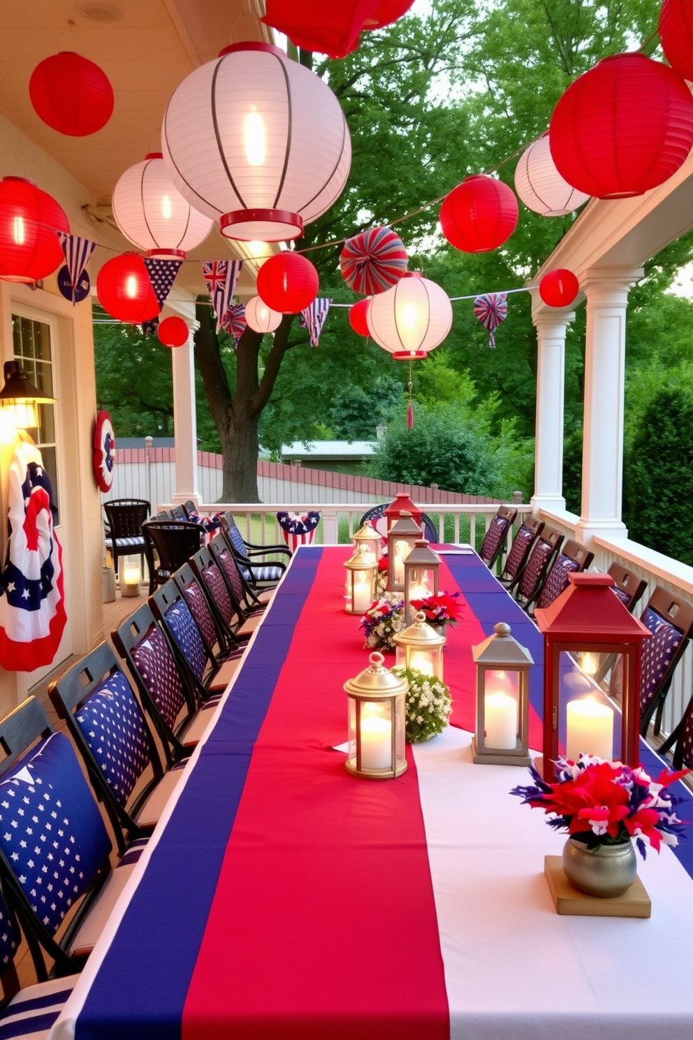 A festive outdoor setting adorned with red white and blue lanterns creates a vibrant atmosphere for Independence Day celebrations. The lanterns are hung from trees and the porch, casting a warm glow as the sun sets. A long dining table is set with a patriotic theme, featuring red white and blue table runners and centerpieces. The lanterns are strategically placed along the table, enhancing the festive spirit of the gathering.