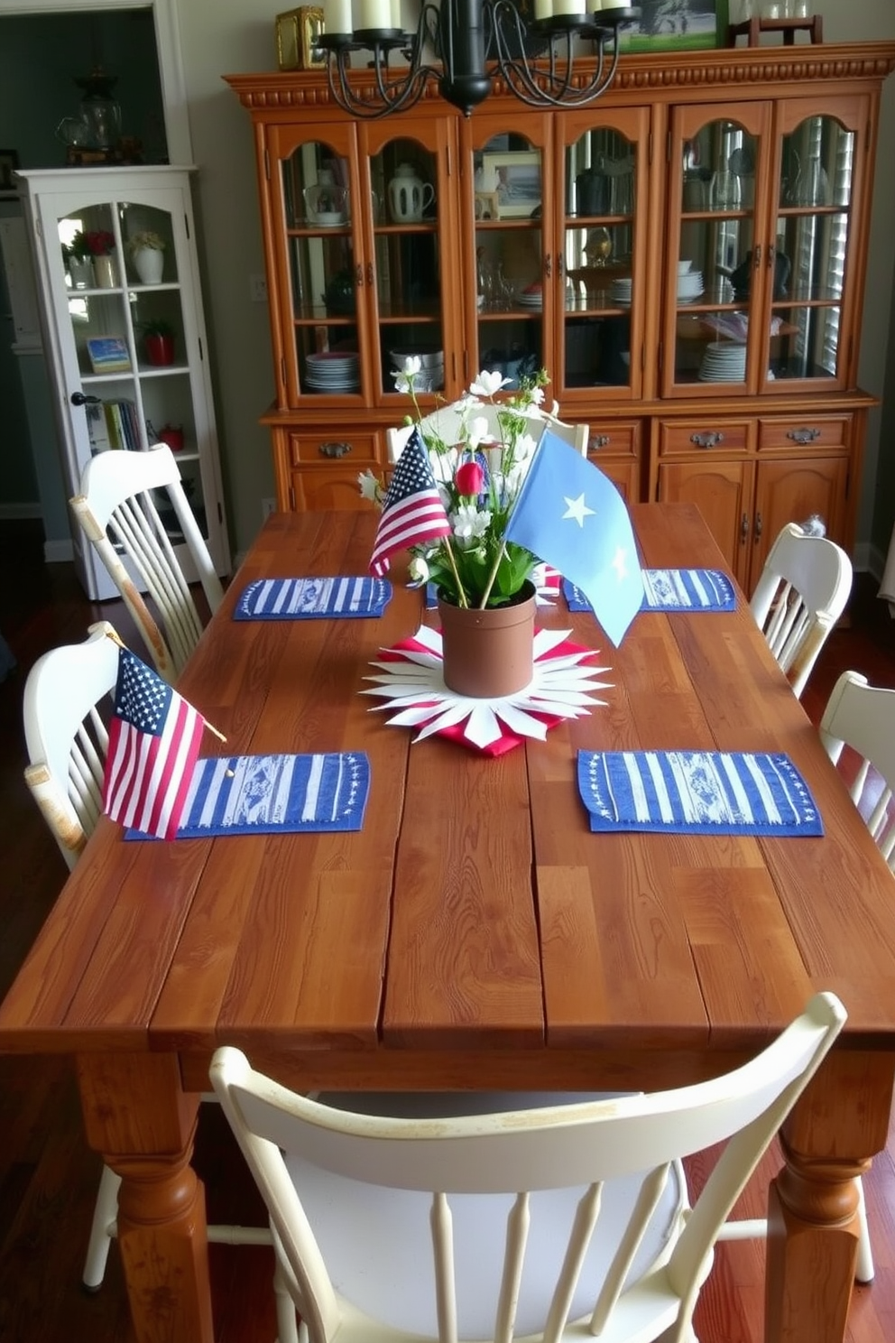 A rustic wooden table is adorned with red white and blue flag accents creating a festive atmosphere for Independence Day. Surrounding the table are mismatched chairs that add charm and character to the dining room setting.