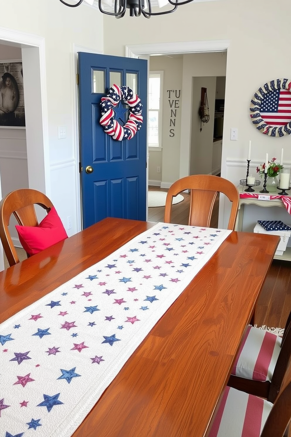 A festive table runner adorned with a star pattern stretches across a polished wooden dining table. Red white and blue accents complement the runner creating a cheerful atmosphere for Independence Day celebrations. The entryway features a welcoming display with patriotic decor including a star-spangled wreath on the door. A small console table is decorated with candles and a flag-inspired centerpiece to enhance the festive spirit.