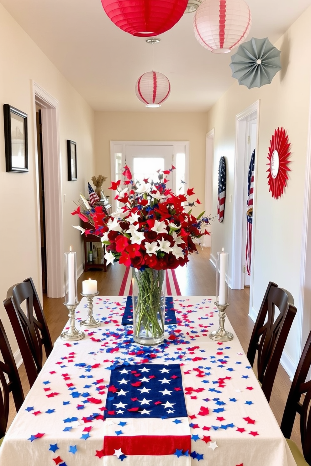 A festive table setting for Independence Day featuring a red white and blue tablecloth adorned with star shaped confetti. Centered on the table is a large vase filled with fresh red white and blue flowers surrounded by decorative candles in patriotic colors. A hallway decorated for Independence Day with hanging paper lanterns in red white and blue. The walls are adorned with framed stars and stripes while a runner with a flag pattern leads the way to the entrance.