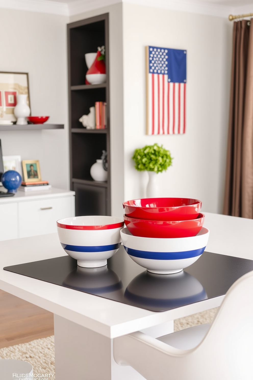 Decorative bowls in red white and blue are artfully arranged on a sleek modern desk in a home office. The vibrant colors of the bowls contrast beautifully with the neutral tones of the room, enhancing the patriotic theme of the space. On a nearby shelf, additional decorative items in similar hues complement the bowls, creating a cohesive and festive atmosphere. A subtle American flag motif is incorporated into the wall art, tying the entire design together for Independence Day celebrations.