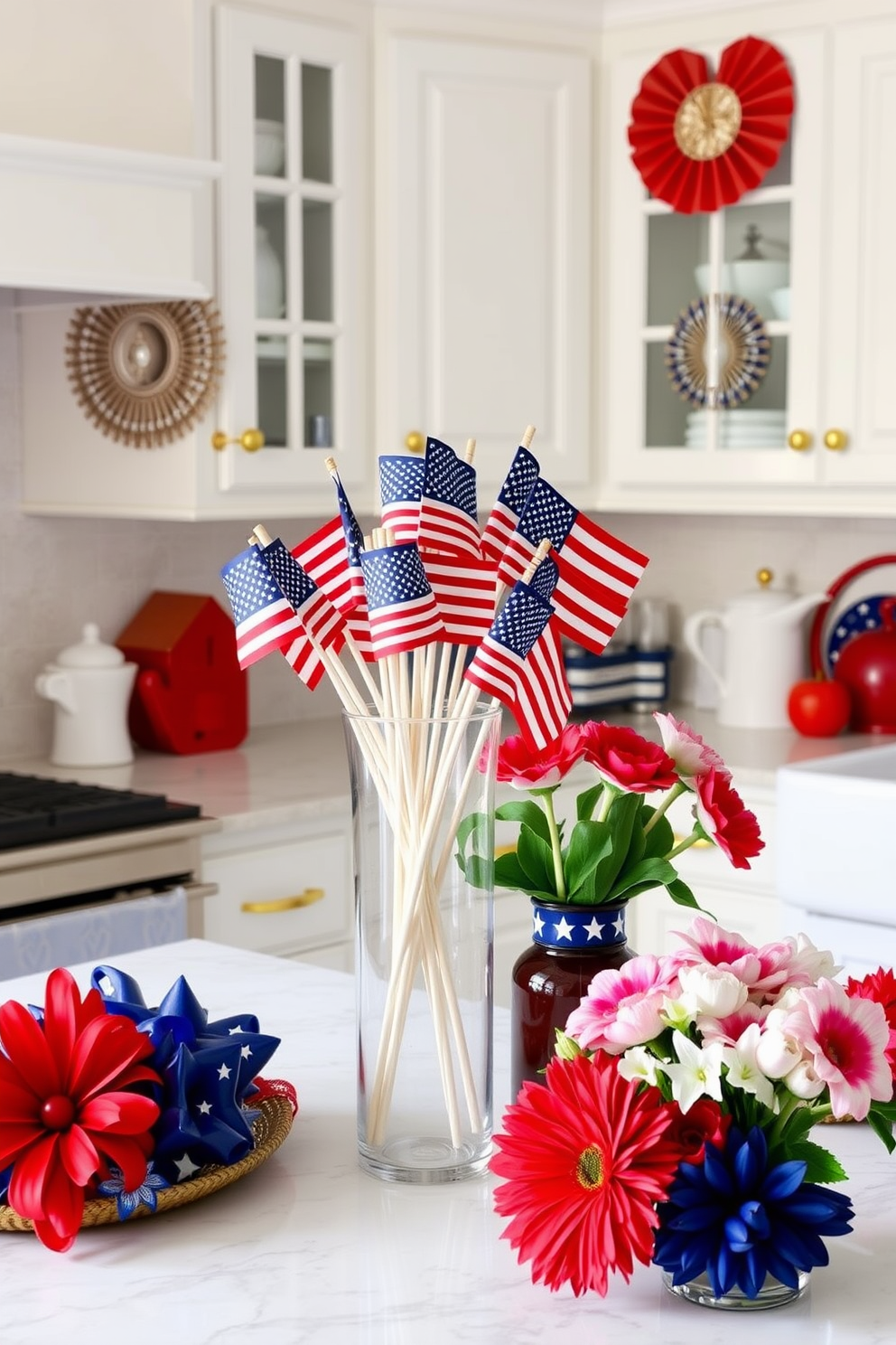 A festive kitchen setting adorned for Independence Day. A clear vase filled with mini American flags takes center stage on the countertop, surrounded by red, white, and blue decorations. The kitchen features white cabinetry with gold hardware and a farmhouse sink. Fresh flowers in patriotic colors are arranged nearby, adding a cheerful touch to the celebration.