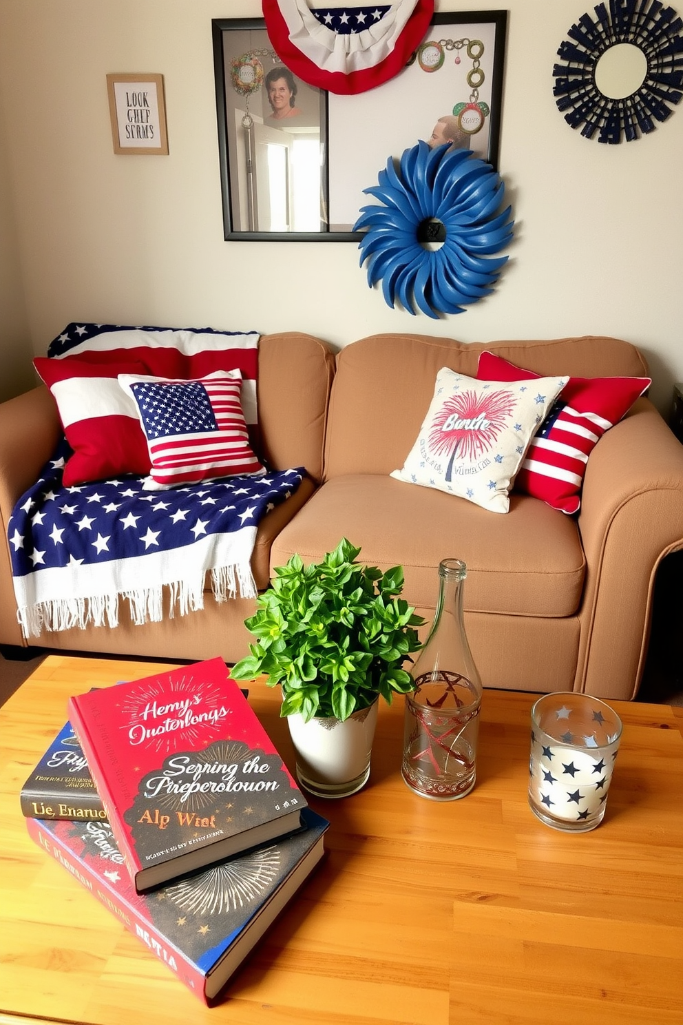 A cozy small living room decorated for Independence Day. The walls are adorned with red white and blue accents including a flag-themed throw blanket on the couch and decorative pillows featuring stars and stripes. On the coffee table sits a collection of patriotic-themed books with vibrant covers showcasing fireworks and the American flag. A small potted plant adds a touch of greenery next to a candle in a glass holder designed with a star pattern.