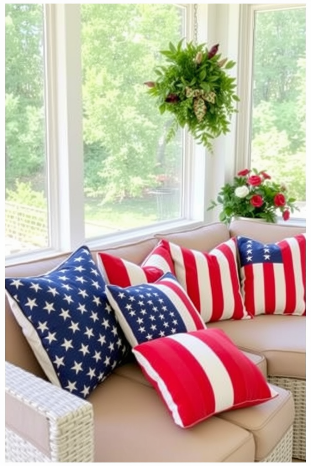 American flag themed outdoor cushions are arranged on a cozy sunroom seating area. The cushions feature vibrant red white and blue patterns that celebrate Independence Day while providing comfort and style.