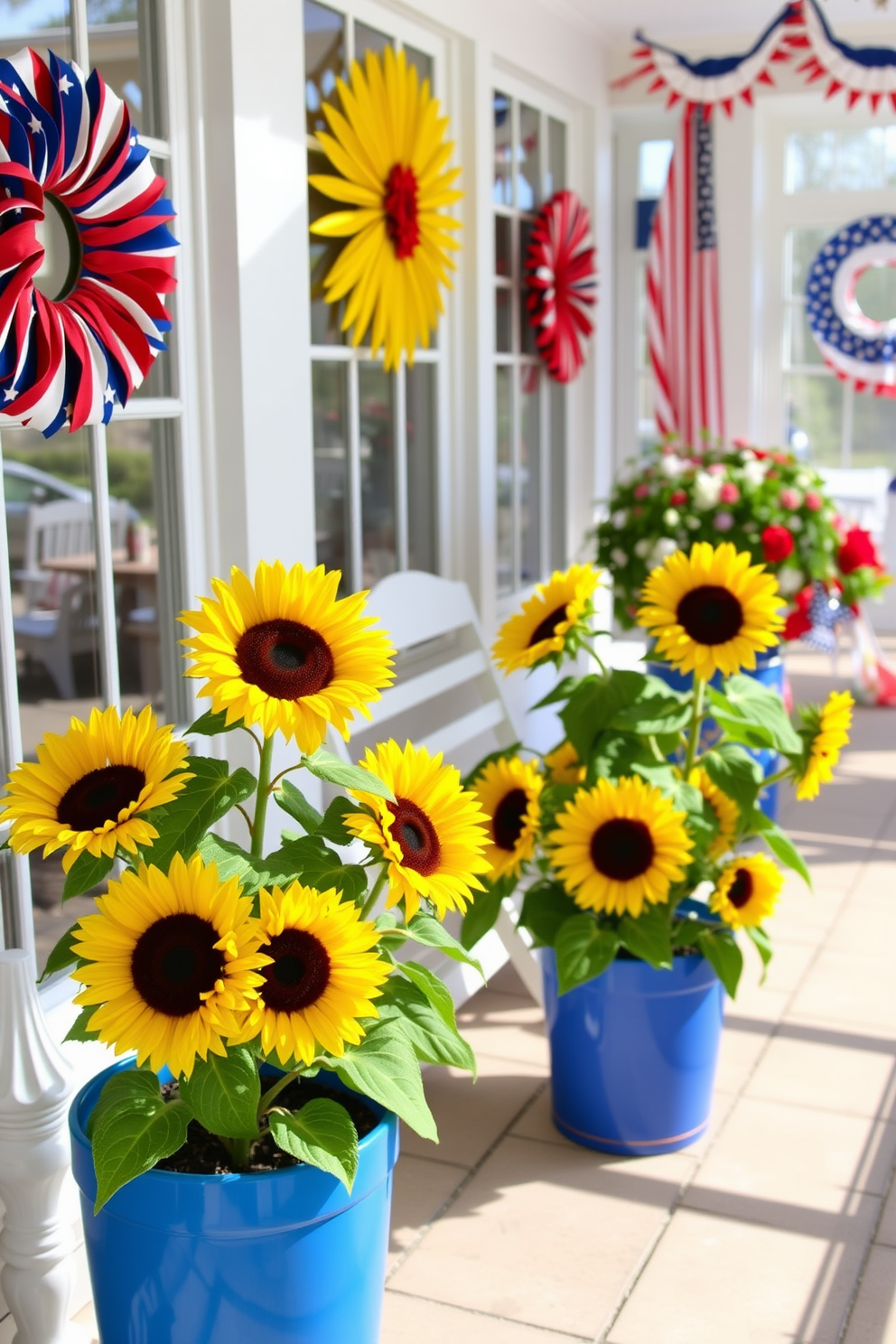 Bright sunflowers in vibrant blue pots create a cheerful atmosphere in the sunroom. The sunroom is adorned with festive decorations that celebrate Independence Day, featuring red, white, and blue accents throughout the space.