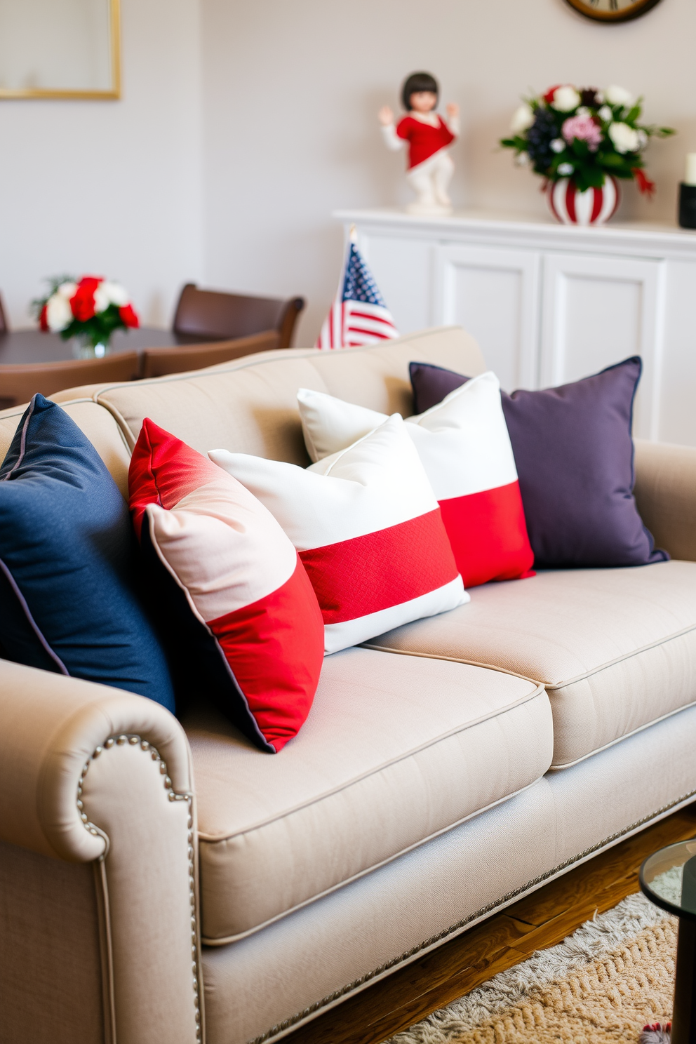 Create a cozy living room scene featuring a stylish sofa adorned with red white and blue throw pillows. The pillows are arranged in a way that adds a festive touch, complementing the neutral tones of the sofa and surrounding decor. In the background, a subtle Labor Day theme is reflected through tasteful decorations, such as a small American flag and seasonal flowers. The overall ambiance is warm and inviting, perfect for celebrating the holiday in an apartment setting.