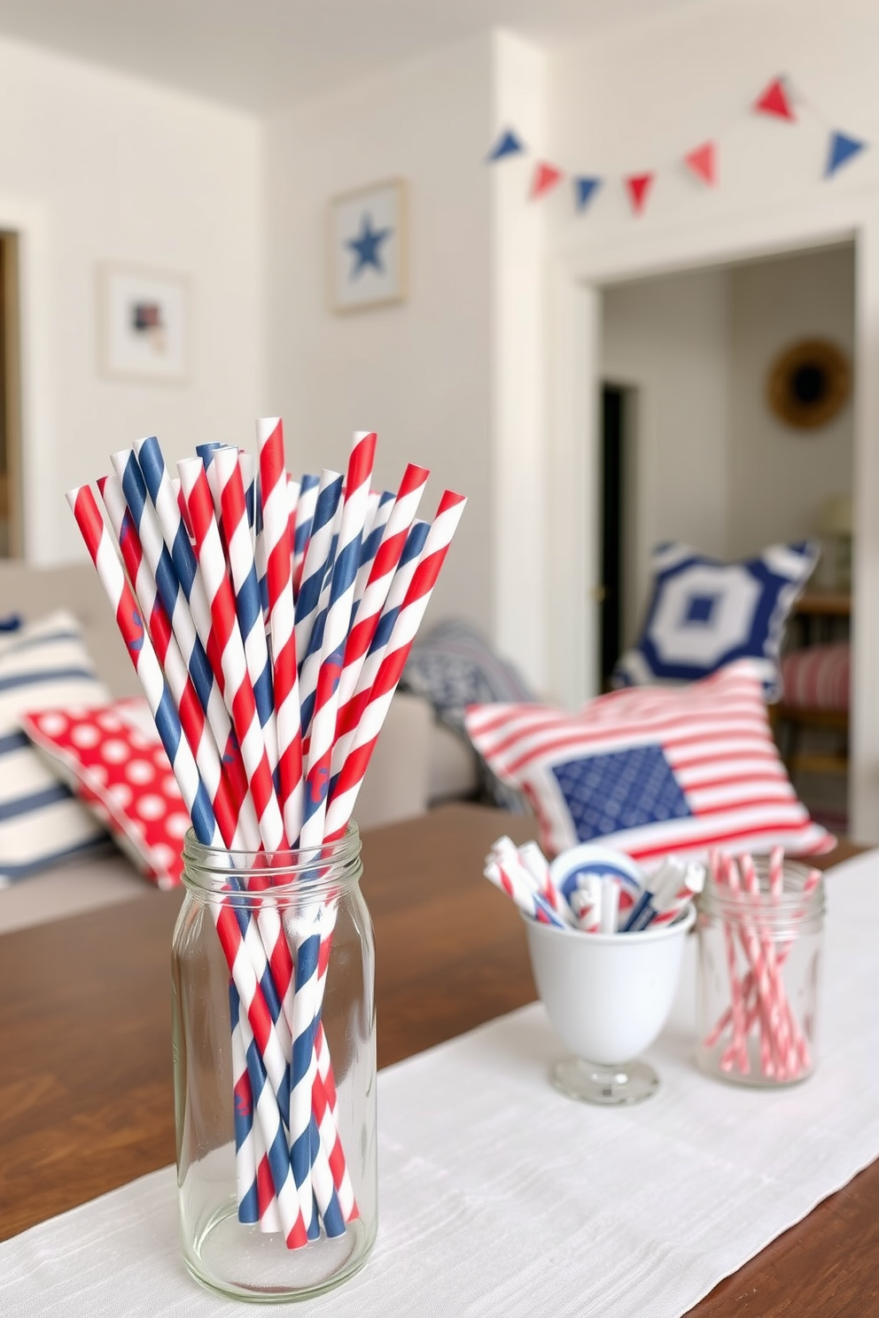 A festive Labor Day celebration setting featuring red white and blue paper straws arranged in a clear glass jar. The backdrop includes a cozy apartment decorated with patriotic-themed cushions and subtle bunting that adds a cheerful touch to the space.