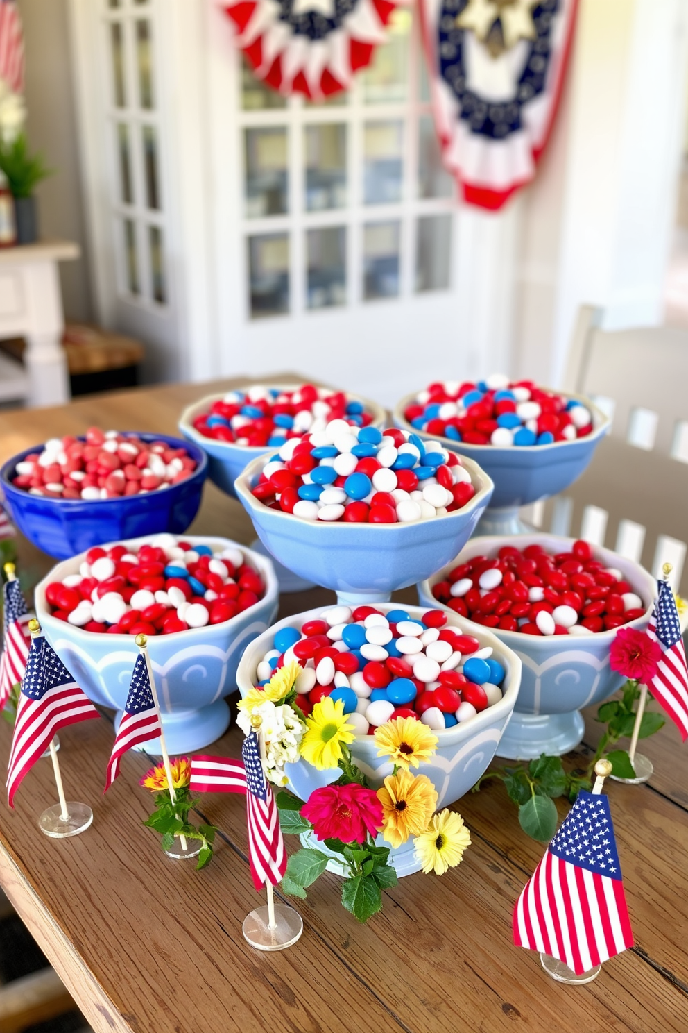 A vibrant display of decorative bowls filled with red white and blue candies creates a festive atmosphere. The bowls are arranged on a rustic wooden table, surrounded by small American flags and seasonal flowers for a cheerful Labor Day celebration.