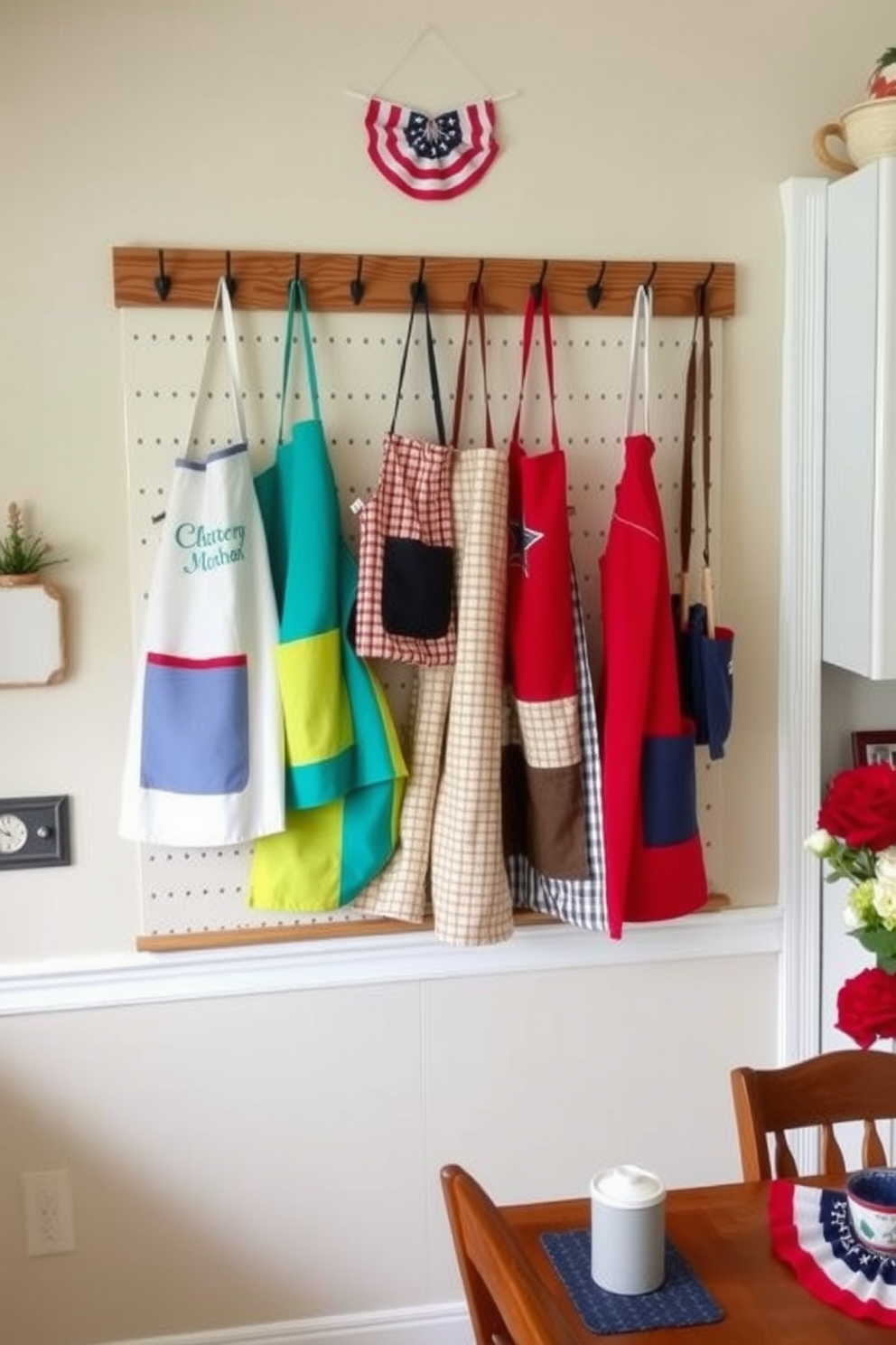 A personalized apron display hangs prominently in the kitchen, showcasing a variety of colorful aprons that reflect individual styles. The backdrop features a rustic wooden pegboard adorned with hooks, allowing for easy access and a charming visual appeal. Incorporated into the decor are seasonal Labor Day-themed elements, such as small flags and red, white, and blue accents. A cozy dining area nearby complements the kitchen, inviting family and friends to gather and celebrate the holiday.