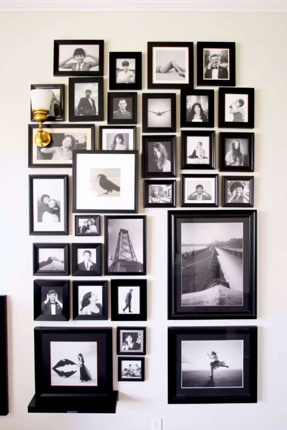 Create a gallery wall featuring an eclectic mix of framed photos in various sizes. The arrangement includes black and white images alongside colorful prints for a dynamic visual impact. Incorporate decorative elements such as wall sconces and floating shelves to enhance the design. Use a neutral color palette for the wall to allow the artwork to stand out beautifully.