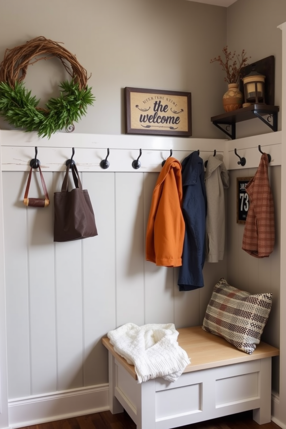 A welcoming mudroom featuring wall hooks for easy access to jackets. The space is adorned with rustic decor and a cozy bench for convenience.