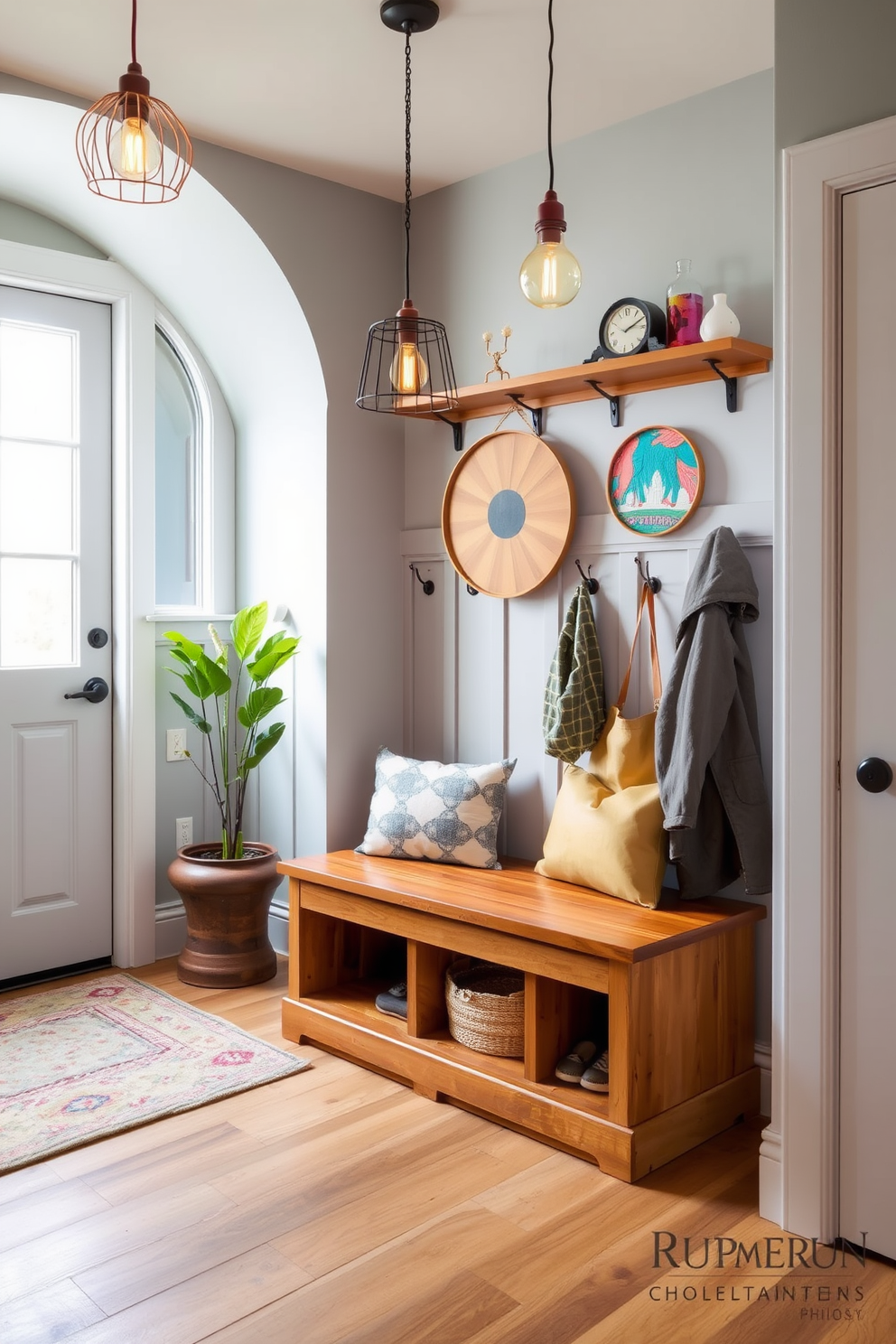 A stylish mudroom featuring unique light fixtures that enhance the space's character. The room includes a built-in bench with storage underneath and hooks for coats, all designed in a warm wood finish. The walls are painted a soft gray, providing a neutral backdrop for vibrant decor. A large window allows natural light to flood the room, creating a welcoming atmosphere.