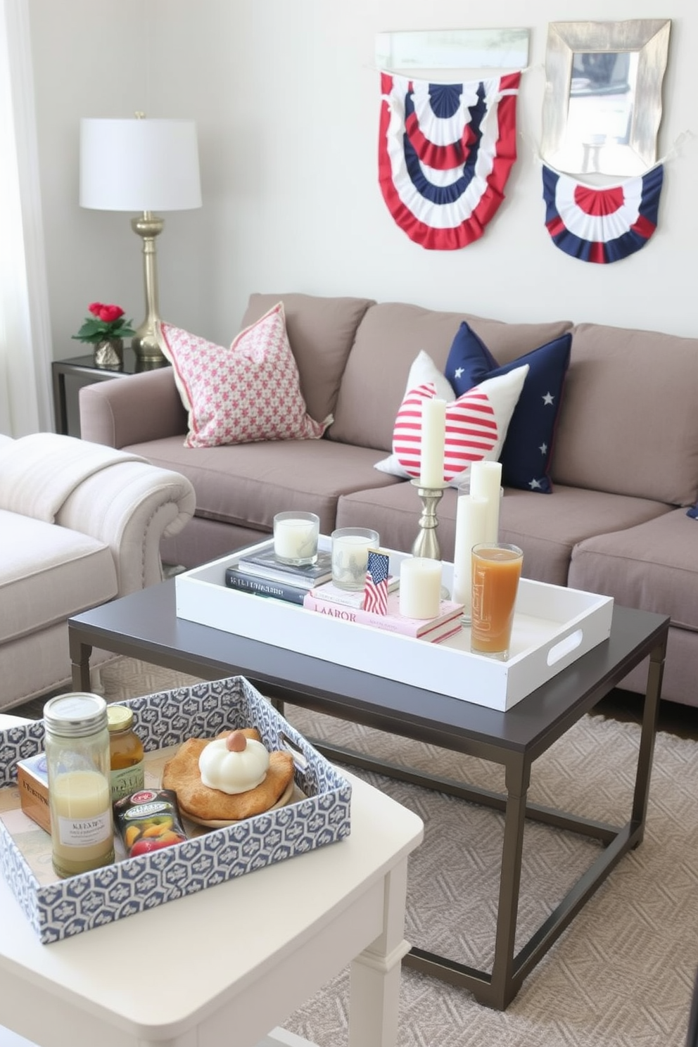 A stylish small living room features a cozy seating arrangement with a plush sofa and a chic coffee table. On the coffee table, decorative trays in various sizes hold books and candles, creating an organized and inviting surface. For Labor Day, the living room is adorned with patriotic accents such as red, white, and blue throw pillows and a festive banner. A small side table showcases a decorative tray filled with seasonal snacks and drinks, perfect for entertaining guests.